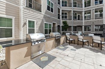 take advantage of the spacious outdoor patio with a grill and seating area